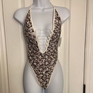 Luxury bodysuit w/ cut out in front & clear string, backless, w/ tags, one size